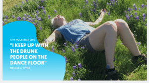 woman happy lying in field after quitting alcohol